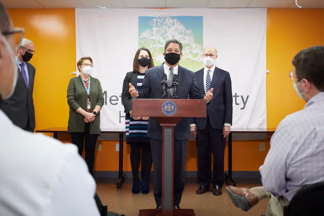 Pennsylvania officials at a public health-coverage enrollment event