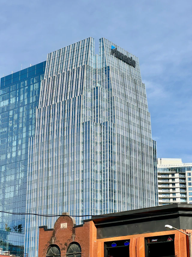 Glass-and-metal Pinnacle office tower rising above downtown Nashville.