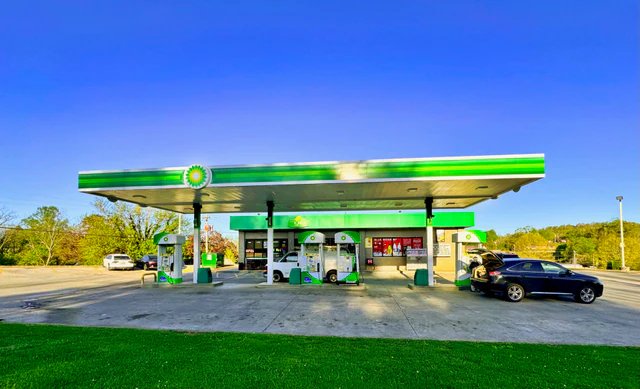 A modern BP gas station with fuel pumps beneath a green-and-white canopy in Blue Ridge, Georgia.