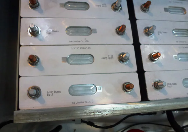Rows of rectangular pouch-style lithium-ion battery cells packaged together as an electric-vehicle battery module.