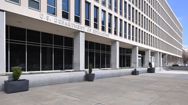 The main entrance of the Lyndon Baines Johnson Building, headquarters of the U.S. Department of Education, with the agency's name carved into the stone facade.